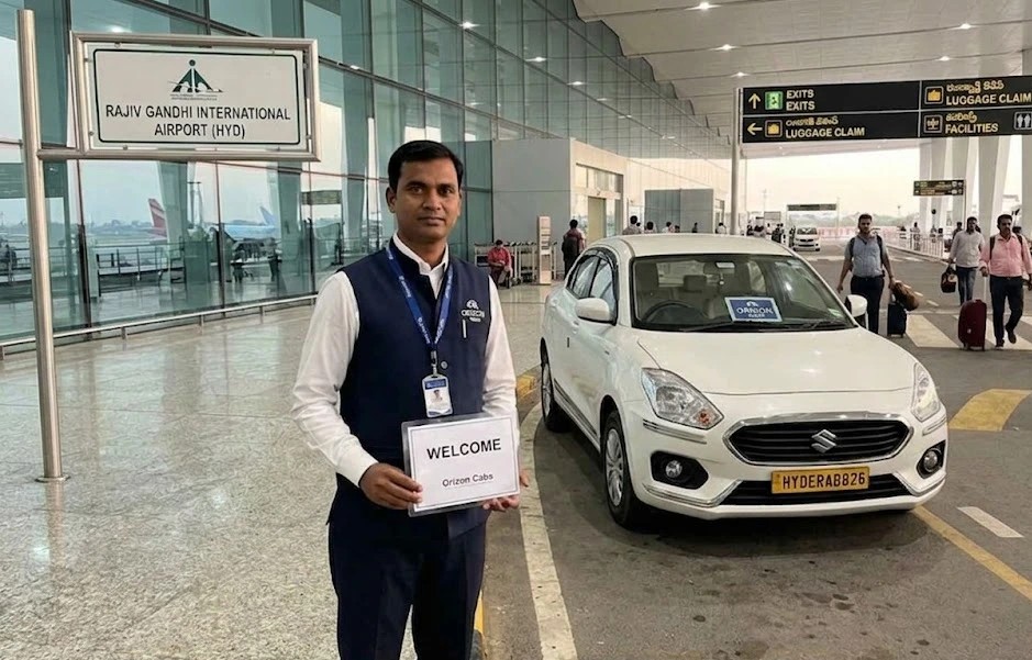 Professional airport cabs Hyderabad service by Orizon Cabs featuring a luxury car and uniformed driver at RGIA.
